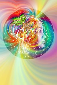 this image shows a rainbow of colors and energy flow going to and from a brain to illustrate that concepts are more important than words