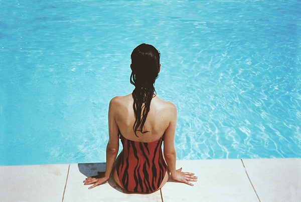 Woman by the water to show that it is necessary to go into the water in order to learn how to swim