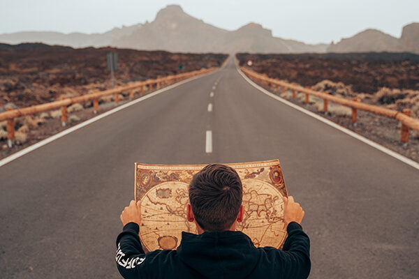 Man looking at a map to show the future that lies ahead