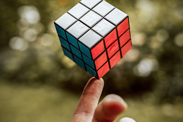 Balancing Rubik's cube on a finger to show how we can find balance and structure in qigong practice