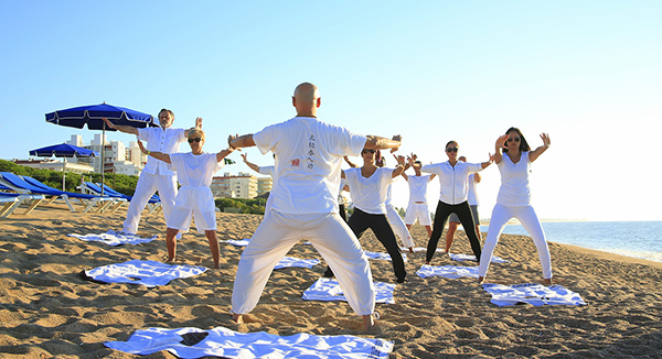 People practicing to show the importance of developing the necessary awareness and skill with our energy in qigong