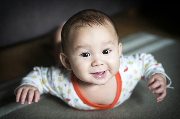 Baby gurgling to show the process of developing skills in life